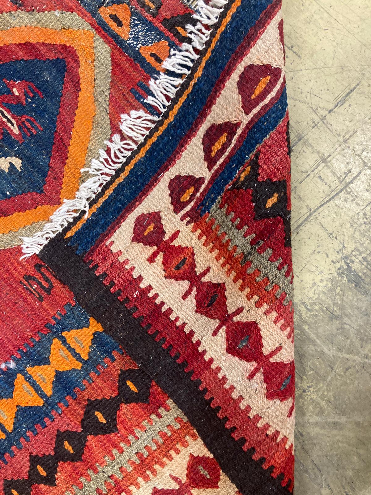 A polychrome Kelim rug, 270 x 134cm.